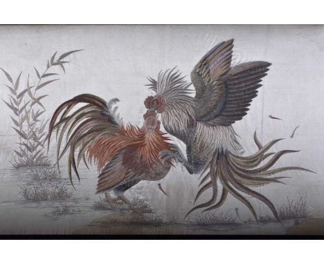 A Japanese silk embroidery, Meiji eraOf horizontal aspect, finely worked in coloured silks with two cockerels fighting in a l