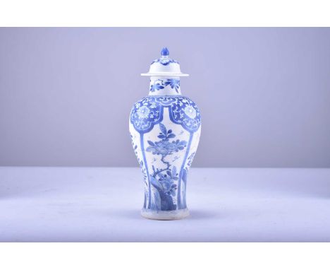 A Chinese blue and white baluster vase and cover from the Bintan cargo, KangxiOf ovoid form, the domed cover with cone finial