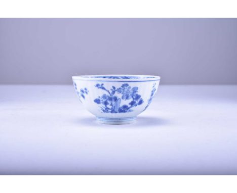 A Chinese blue and white porcelain bowl, Kangxi, circa 1700From the Bintan cargo, of fluted form with a deep foot ring, decor
