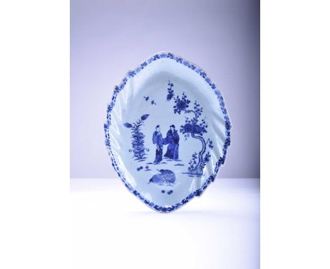 A rare Chinese export blue and white leaf-shaped 'Quail' dish, Qianlong, circa 1765Decorated with a man and woman standing be