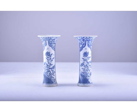 A pair of Chinese blue and white sleeve vases from the Bintan cargo, KangxiOf slender form with flared rims, decorated with p