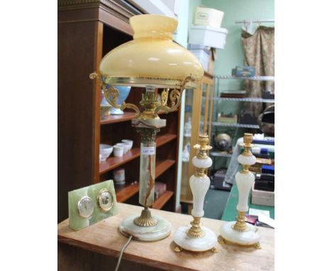 AN ONYX TABLE LAMP, together with a pair of candlesticks and a desktop weather station 
