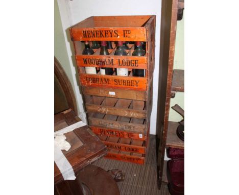 THREE DECORATIVE WINE CRATES FROM 'HENEKEYS LTD' OF COBHAM, one containing a selection of 20th century red wine various 