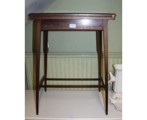 A SATINWOOD BANDED MAHOGANY FINISHED REVOLVING TOPPED CARD TABLE 