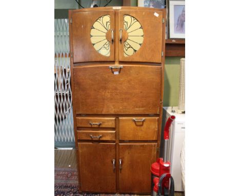 A MID-CENTURY LARDER UNIT TITLED 'PRESTIGE' a Crondale product, featuring numerous cupboard doors, drawers, and a fall-down p