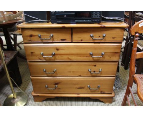 A MODERN PINE CHEST OF FIVE DRAWERS 
