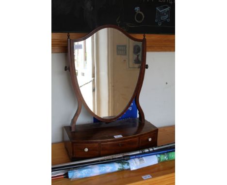 A 19TH CENTURY MAHOGANY FINISHED SHIELD SHAPED DRESSING TABLE MIRROR on a box base unit, with three inline drawers 