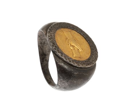 Ring. Rome, 2nd-3rd century AD. In gold and silver. Seal representing the "dextrarum iunctio", symbol of concord, both in pri