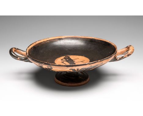 Kylix; Attica, 6th century BC. Black glazed ceramic. Measures: 7 x 25 cm. The piece presented here is a kylix, a Greek cerami