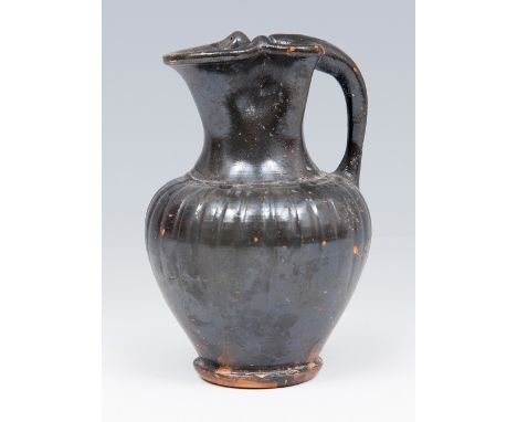 Etruscan Oinochoe, 6th century BC. Black glazed ceramic or bucchero. Measures: 10 x 7,5 x 7,5 cm. The oinochoe is a wine jug 