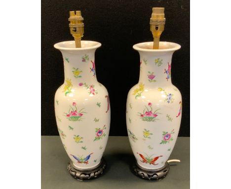 Lighting - a pair of Chinese side lights, decorated with butterflies and foliage, 35cm high, hardwood bases 