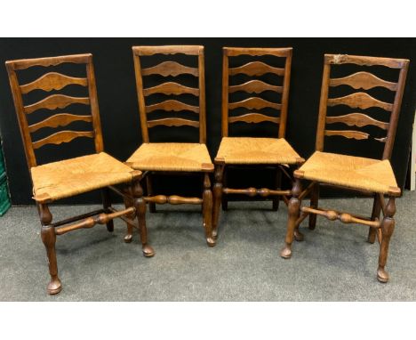 A set of four mid  19th century ladder back chairs, rush seats, c.1850 (4) 