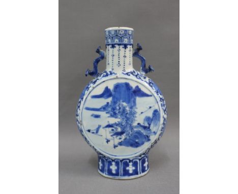 Chinese blue and white pilgrim / moon flask, with landscape panels and floral ground, has four character Kangxi marks to the 