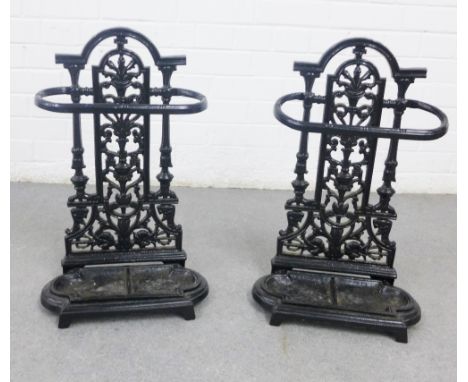 A pair of black painted metal stick stands, likely reproductions, 54 x 31cm (2)