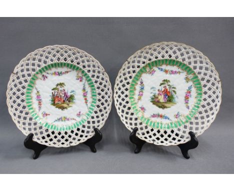 Pair of continental porcelain cabinet plates with reticulated rims and painted with figures, each a with a blue underglaze sc