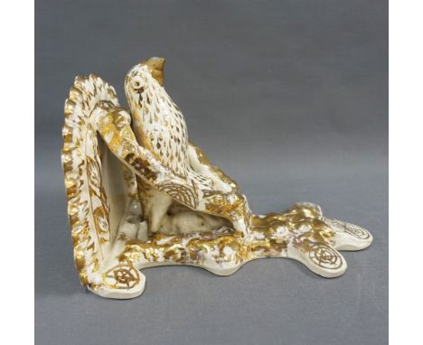 19th century cream glazed pottery wall shelf / bracket, with gilt highlights, 29cm long  