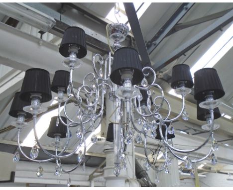CHANDELIER, twelve branch in chromed metal frame with crystal drops and black shades, 97cm H x 120cm. (with faults, two drops
