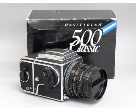 Hasselblad 500C/M Camera no.ES1434664, with Carl Zeiss T* Planar f2.8 80mm lens and film back, in original boxWinds smoothly 