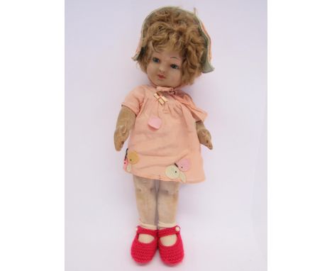 A 1920s/30s Chad Valley 'Bambina' articulated cloth doll, the moulded face with inset blue glass eyes and painted features, l