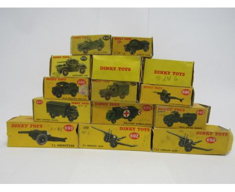 A collection of fourteen boxed Dinky Toys diecast military vehicles to include 623 Covered Army Wagon, 626 Military Ambulance
