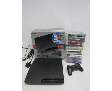 A boxed Sony PlayStation PS3 computer games console with controller, leads and games to include Farcry 3, The Last Of Us, Ang