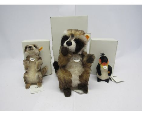 Three boxed Steiff mohair animals to include 045547 Rocco racoon, 27cm tall, 045257 Cockie meerkat, 19cm tall, and 045677 Hip