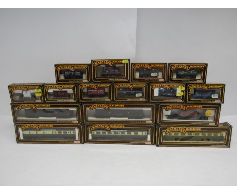 Seventeen boxed Palitoy Mainline 00 gauge model railway coaches and coods wagons to include #'s 37418, 54209, 54207, 54308, 9