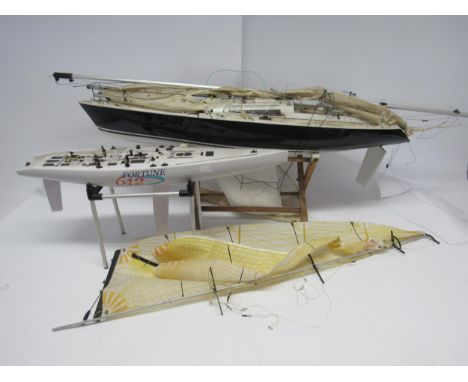 A Kyosho Fortune 612 model racing yacht, approx. 61cm long, together with another larger model yacht, approx. 87cm long (2, a