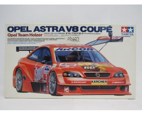 A Tamiya 24248 Opel Astra V8 Coupe 1:24 scale plastic model kit, contents unchecked but appearing complete and unstarted
