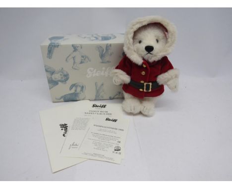 A boxed Steiff limited edition 037252 white alpaca Santa Claus Teddy Bear, Christmas 2008, with button and white tag to ear, 