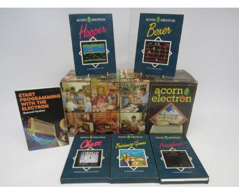 A boxed Acorn Electron vintage home computer system with five boxed games to include Hopper, Boxer, Chess, Business Games and