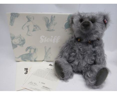 A boxed Steiff 662997 Bell Boy Bear articulated grey mohair teddy bear with growler, wearing collar with brass bells, button 