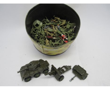 A Crescent diecast military Saladin Armoured Car, Ammunition Limber and Field Gun, together with a tin of plastic soldiers