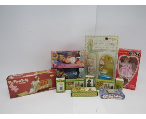 A collection of mid 20th Century boxed dolls and accessories to include Palitoy 'Carrie' and 'Christopher' dolls in window bo