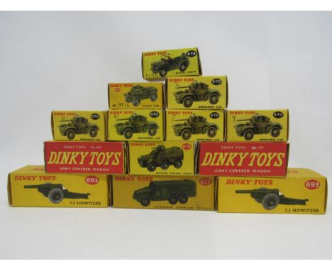 A collection of thirteen boxed Dinky Toys diecast military vehicles to include 623 Covered Army Wagon (x2), 670 Armoured Car 