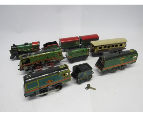 A group of 0 gauge model railway locomotives and rolling stock to include Mettoy 2-4-0 electric locomotive no. 393 with tende