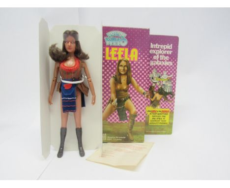 A 1976 Denys Fisher Toys Doctor Who Leela action figure, housed in original pictorial card box with card inner and consumer s
