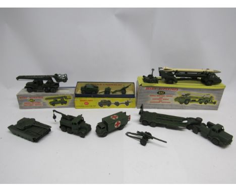 Three boxed Dinky Toys diecast military vehicles to include 666 Missile Erecting Vehicle with Corporal Missile and Launching 