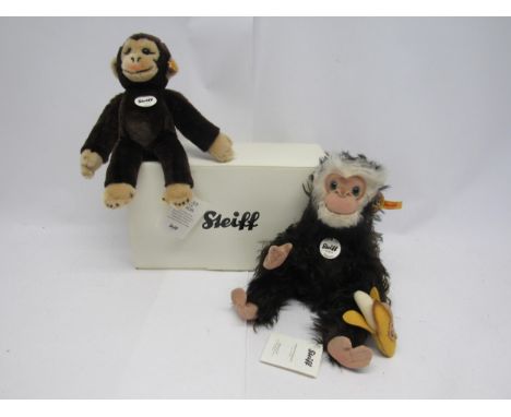 A boxed Steiff 035128 Najumo articulated brown mohair monkey with felt face, hands and feet, holding felt banana, 33cm tall, 