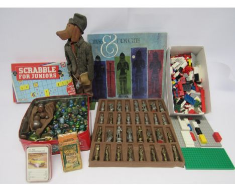 Mixed toys and games including loose vintage Lego, cast metal chess set, carded wooden figure of a dog in hunting attire, tin
