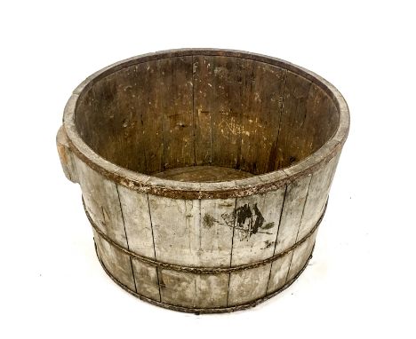 A large, coopered, circular planter with iron banding (doubles up as a rustic log-bin). Height: 38 cm, Dia: 60 cm.