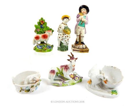 A collection of various ceramic pieces: Staffordshire style goat together with other figurines; all a/f.