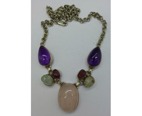 A silver, amethyst and quartz necklace