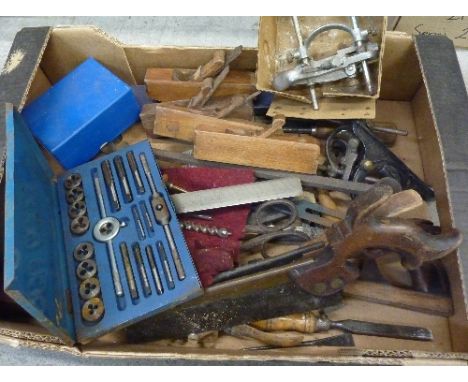 A collection of tools including a steel Rolls Royce ruler by Chesterman, woodworking planes, chisels, a Rapier plane, a tap a