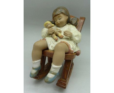 A Lladro figure, 2322, Naptime, girl in rocking chair, height 12.5cm