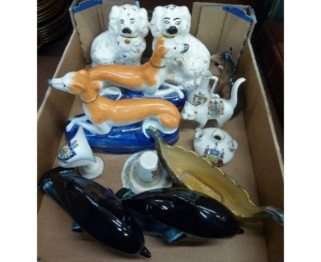 A pair of Royal Doulton Staffordshire style dogs, two Poole dolphins, a Beswick foal, a Wade boat, five crested items and a p