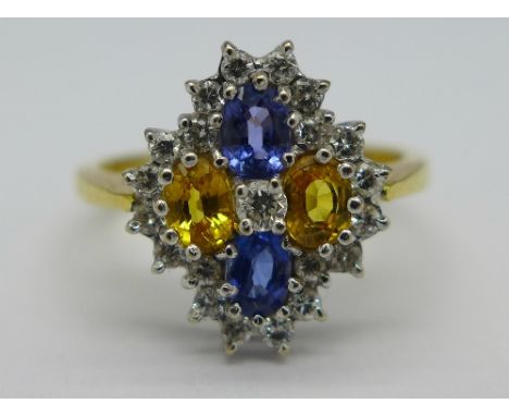 An 18ct gold, diamond, blue and yellow sapphire cluster ring, weight 3.6g, size K½