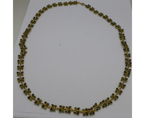 An enamel and gilt metal necklace with butterfly shaped links