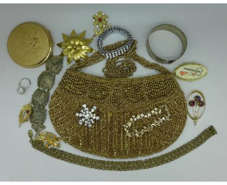 A beaded bag, costume jewellery, a compact, etc.