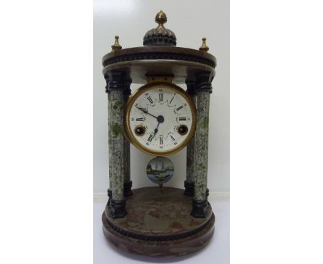 A portico clock with enamel dial and striking movement, height 38cm